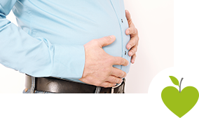 Mann hält sich den Bauch Mann hält sich den Bauch